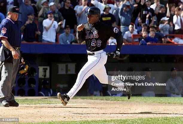 New York Mets' Jon Nunnally crosses home plate to win the game on Matt Franco's RBI single in the bottom of the ninth inning of game against the Los...