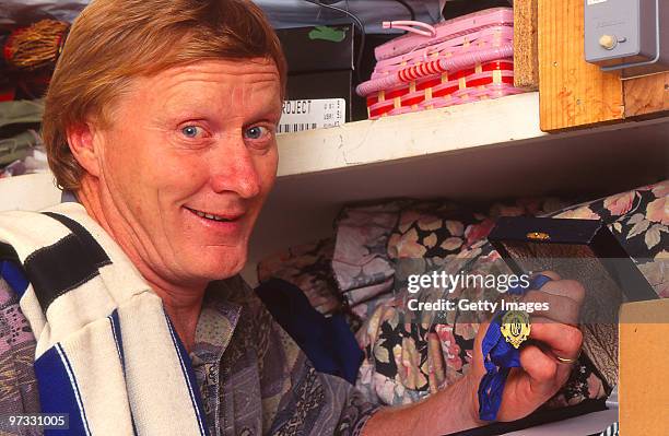 Keith Greig former player with the North Melbourne Kangaroos poses with his Brownlow Medal, 1996 in Melbourne, Australia.