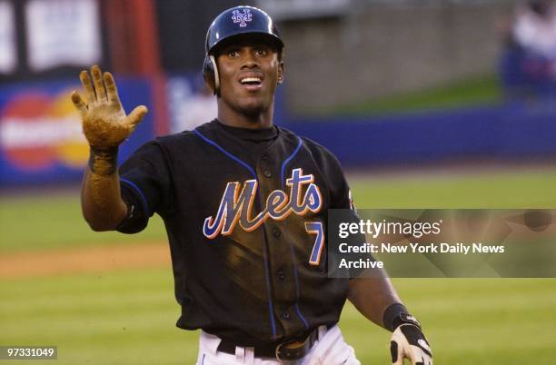 New York Mets' Jose Reyes calls for a time out sliding for a triple in the third inning against the Milwaukee Brewers at Shea Stadium. Reyes later...