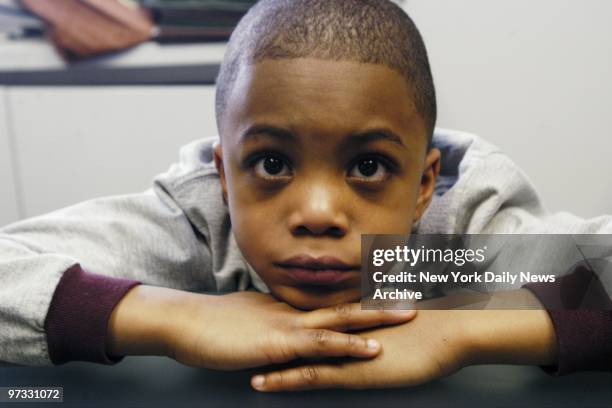 Taysir Mack in the office of his family's lawyer, where they charged that music teacher Jason Schoenberger hung the boy by his ski jacket loop from a...