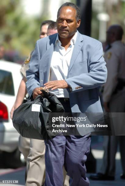 Simpson walks out of the Clark county detention center after making bail. Simpson posted $125,000 bail in connection with an armed robbery of sports...