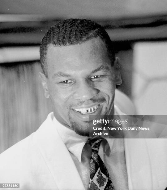 Mike Tyson speaks to crowd in front of the Apollo Theatre in Harlem.