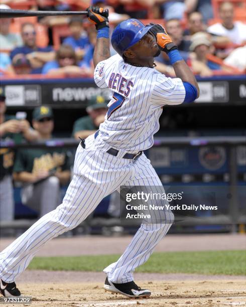 New York Mets' Jose Reyes leads off the bottom of the first inning with a double to right that resulted in his scoring on a two-base error by Oakland...