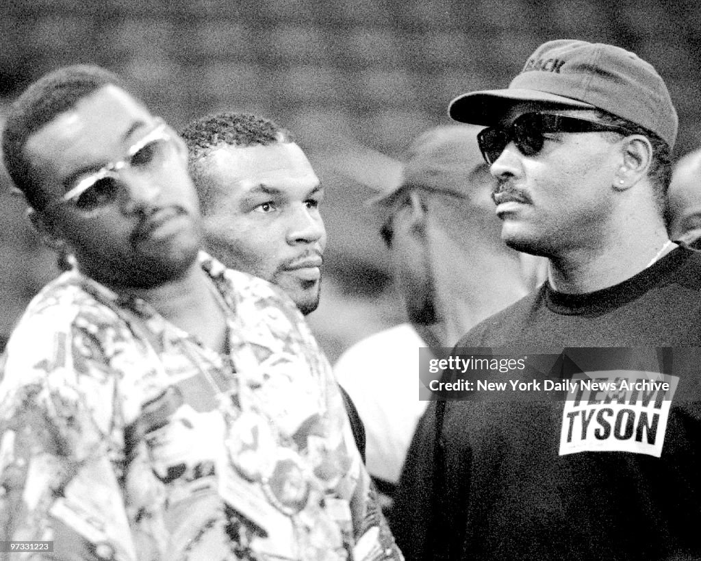 Mike Tyson Center Is Surrounded By Bodyguards As He Arrives For mike-tyson-center-is-surrounded-by-bodyguards-as-he-arrives-for