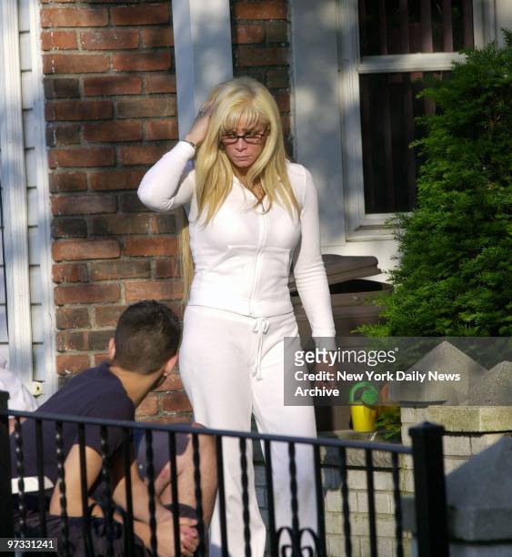 Victoria Gotti, daughter of the late Gambino crime family boss John Gotti, grieves outside her father's home in Howard Beach, Queens. John Gotti died...