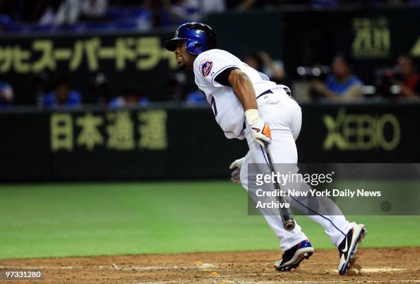 New York Mets' Jose Reyes singles in the fifth inning of Game 1 of the Japan All-Star Series between the MLB All-Stars and the Nippon Professional...