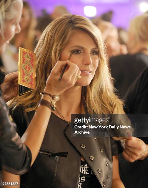 Victoria's Secret model Heidi Klum having her hair and makeup done before the fashion show at the Manhattan Armory on Lexington Ave.