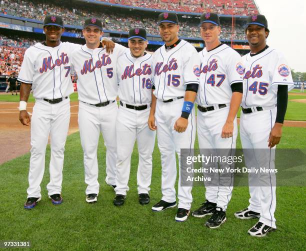 New York Mets' Jose Reyes, David Wright, Paul Lo Duca, Carlos Beltran, Tom Glavine and Pedro Martinez line up on the field at Shea Stadium before the...