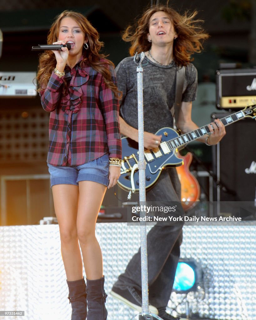 Miley Cyrus performing in a packed Bryant Park on the Good M