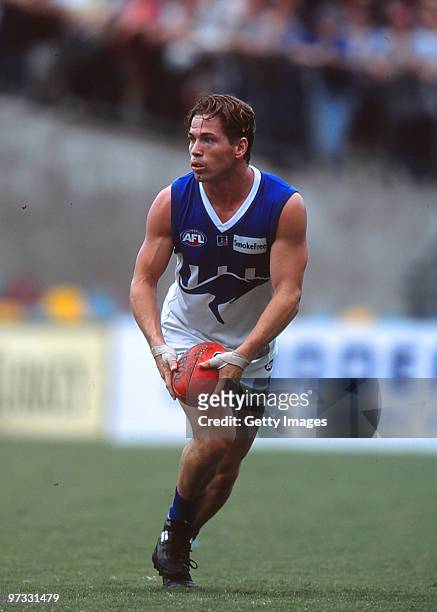 Shannon Grant of the Kangaroos looks upfield during the round two AFL match between North Melbourne Kangaross and Brisbane Lions at the MCG on April...