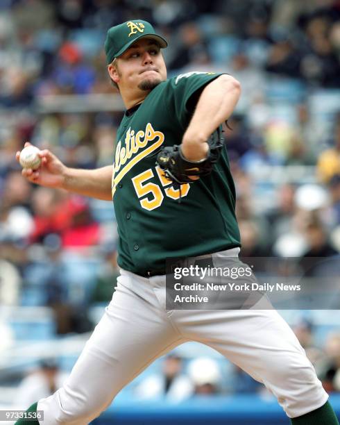 Oakland Athletics' starter Joe Blanton delivers a pitch against the New York Yankees in the first inning of game at Yankee Stadium. He allowed four...