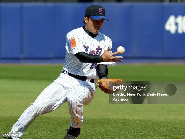 New York Mets' Kaz Matsui bobbles the ball and fails to get the out at first during the eighth inning of game against the Milwaukee Brewers at Shea...