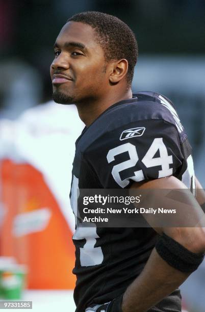 Oakland Raiders' cornerback Charles Woodson smiles as the AFC divisional playoff game against the New York Jets at Network Associates Coliseum ends...