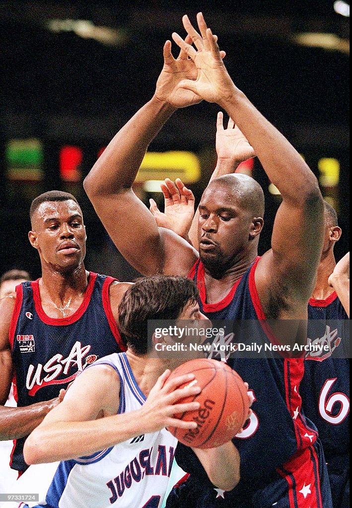 Team USA basketball player Shaquille O'Neal guards Yugoslavi