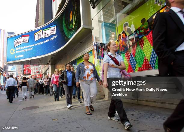 Die-hard Elmo fans file into Toys "R" Us in Times Square in the hopes of buying an Elmo T.M.X. Doll. T.M.X. - which stands for "Tickle-Me-Elmo Ten"...