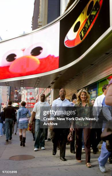 Die-hard Elmo fans file into Toys "R" Us in Times Square in the hopes of buying an Elmo T.M.X. Doll. T.M.X. - which stands for "Tickle-Me-Elmo Ten"...