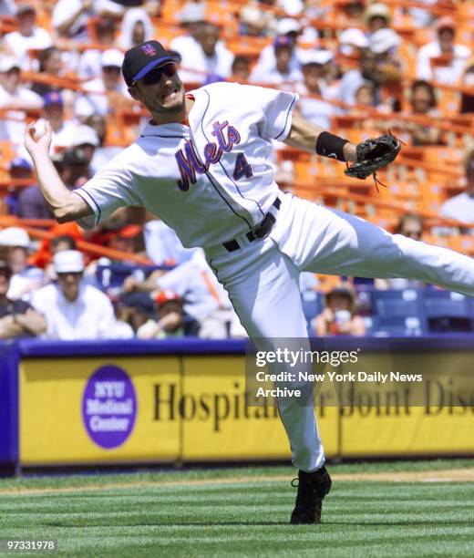 Milwaukee Brewers' Robin Ventura is a leaning-tower of strength as he makes throw to first to get the out after scooping up a grounder in game...