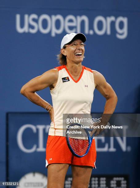 Tennis legend Martina Navratilova laughs as she and fellow American Bob Bryan take on Anna-Lena Groenefeld of Germany and Frantisek Cermak of the...