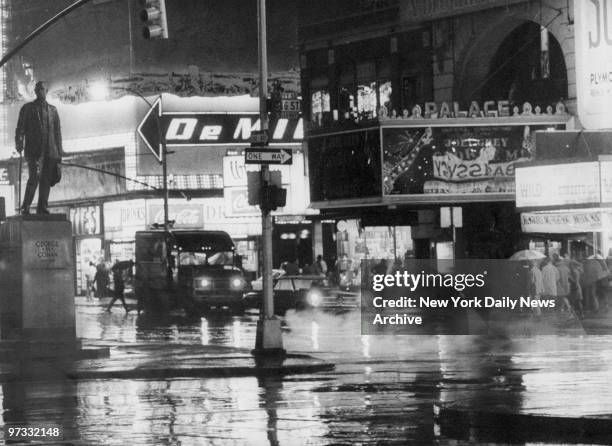 View of the statue of George M. Cohan standing in Duffy Square across the street from the Palace Theater.