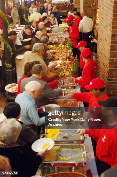 Diners choose from a selection of foods as Riese Restaurants group hosts their annual Holiday Senior Breakfast for 250 Citymeals-on-Wheels homebound...
