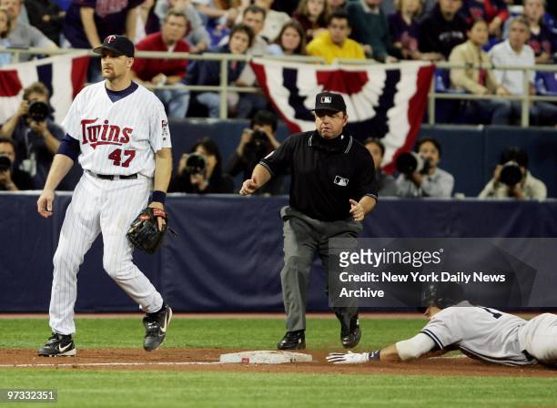 Minnesota Twins' Corey Koskie stands by as New York Yankees' Alex Rodriguez steals third base in the 11th inning of Game 4 of the American League...