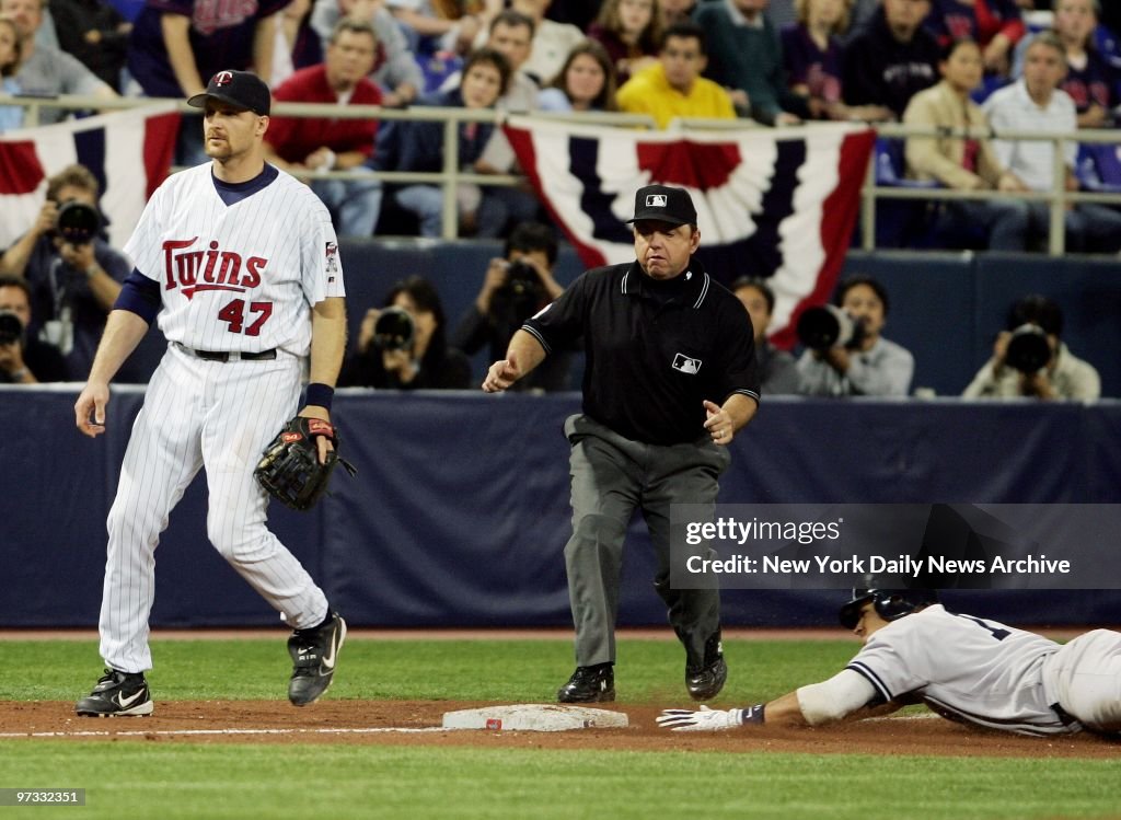 Minnesota Twins' Corey Koskie stands by as New York Yankees'