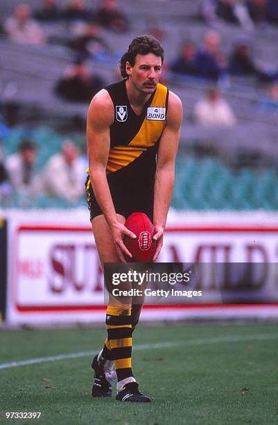 Michael Roach of the Richmond Tigers kicks during a VFL match in Melbourne, Australia.