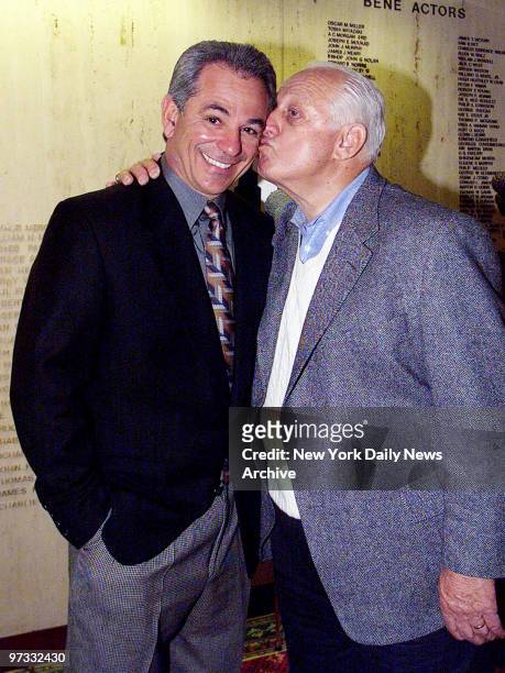 New York Mets' manager Bobby Valentine gets a kiss from Los Angeles Dodgers' vice president Tommy Lasorda at the New York Athletic Club, where...