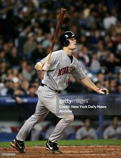 Minnesota Twins' Justin Morneau hits a solo home run, giving the Twins a 3-2 lead in the sixth inning of game against the New York Yankees at Yankee...