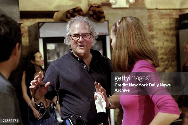 Director Barry Levinson talks with actor Mark Ruffalo and actress Heather Burns during filming of "The Beat," a new police series being shot at the...