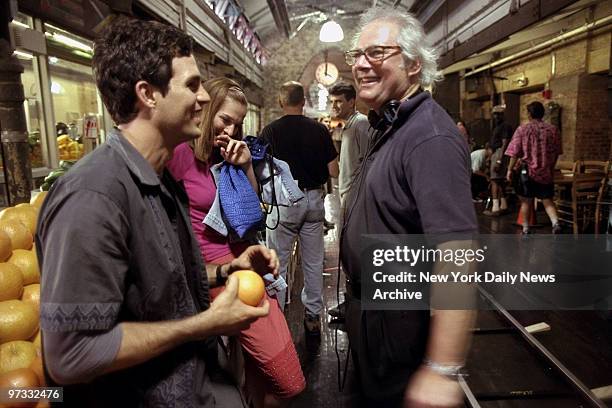 Director Barry Levinson talks with actor Mark Ruffalo and actress Heather Burns during filming of "The Beat," a new police series being shot at the...