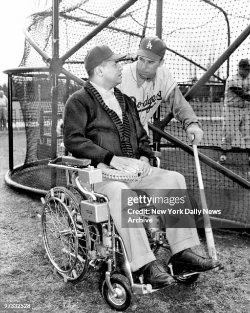 Old mates Pee Wee Reese and Roy Campanella chat at Vero Beach where the disabled backstop has a special coaching job.