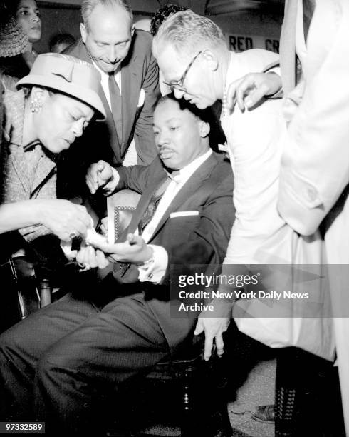 Views of Rev. Martin Luther King, as he was stabbed in chest with letter opener. King was treated at W. 123d Street Police Station as well as Harlem...
