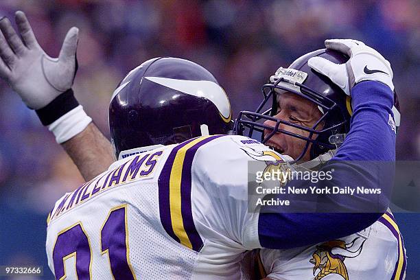Minnesota Vikings' Moe Williams is congratulated by teammate after he returned a kickoff 85 yards for a touchdown against the New York Giants at...