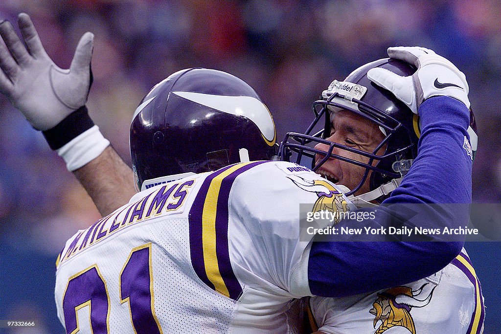Minnesota Vikings' Moe Williams (left) is congratulated by t
