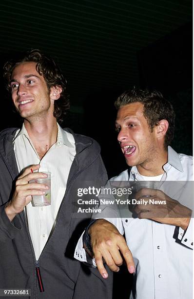 Oliver Hudson , Goldie Hawn's son, and actor Marc Rose enjoy the party at Conscience Point in Southampton, L.I.