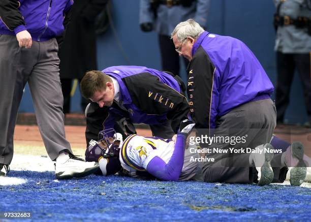 Minnesota Vikings' Randy Moss lies on ground in end zone after being injured during the first quarter of the NFC Championship Game against the New...