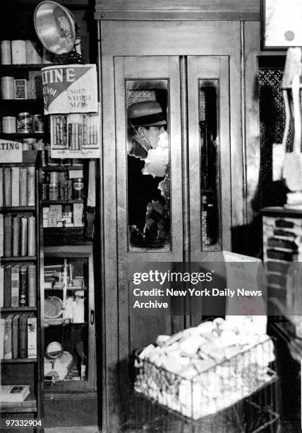 Telephone booth where gang killer Vincent Coll was shot to death in drug store at 314 W. 23d Street.