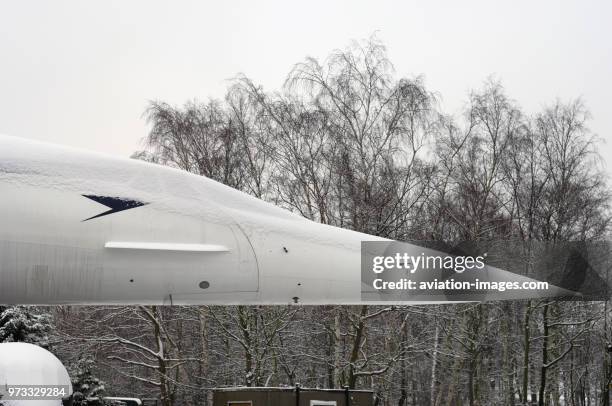 Snow-covered British Airways Aerospatiale BAC Concorde at the Brooklands Museum.