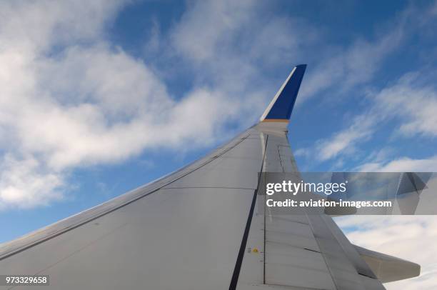 Wing and winglet of a Continental Airlines Boeing 737-824 flying enroute EWR-SEA as flight-number CO1881.