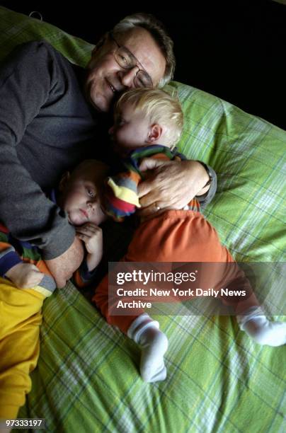 Director Milos Foreman at his home in Manhattan with his 15-month-old identical twin sons Jim and Andy .