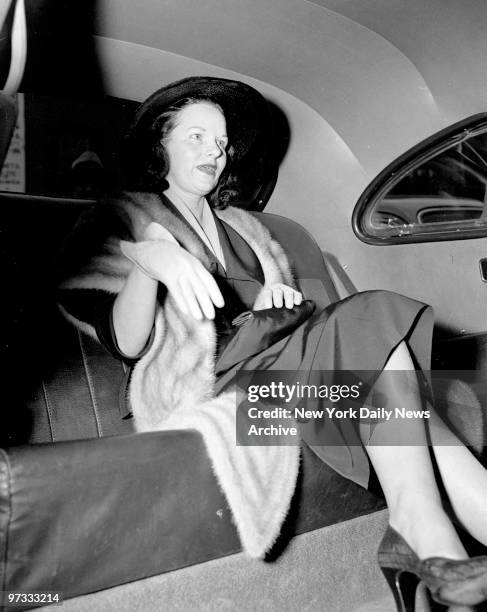 Virginia Hill in a cab after ordeal with senators and the press in connection with her appearance at the crime investigating committee hearing in the...