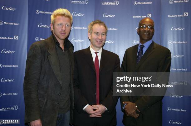 Tennis legend John McEnroe is flanked by Boris Becker and Edwin Moses at his induction into the Laureus World Sports Academy at Cartier on Fifth Ave....