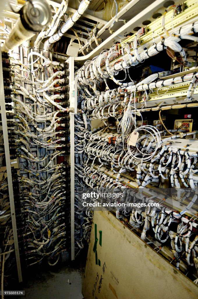 Bundles of electrical wires in avionics bay below the main deck during an inspection at BASCO