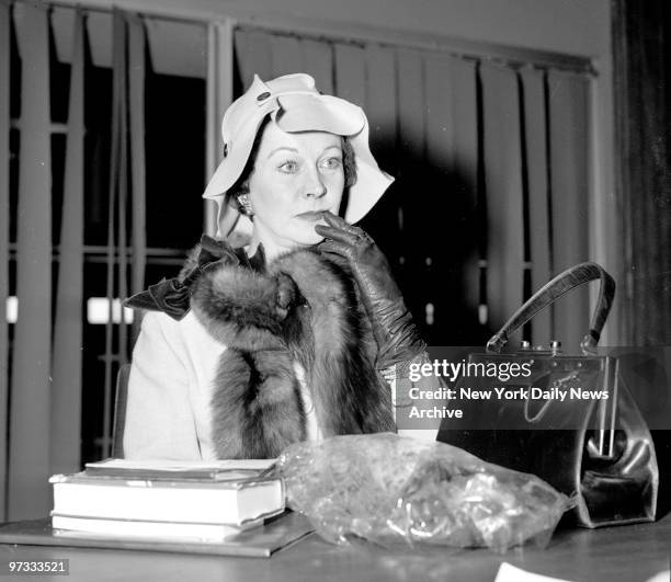 Vivien Leigh in a pensive mood as she talks to reporters at International Airport about her marital situation.