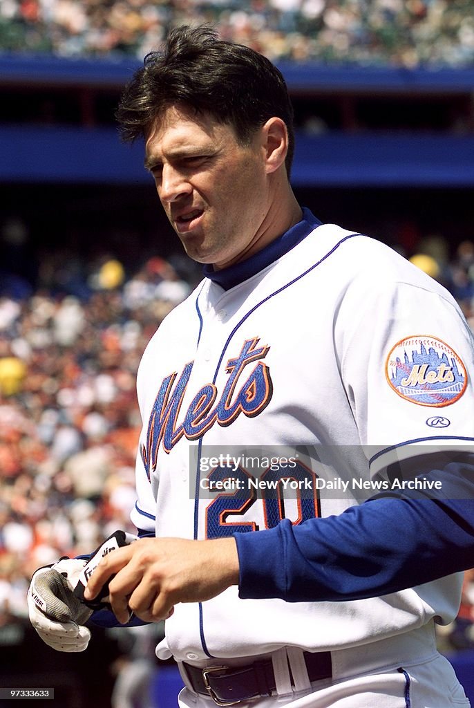 New York Mets' Mark Johnson grimaces after grounding out on