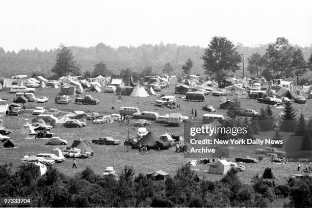 Tent city springs up on hillside in Bethel, N.Y. For Woodstock music festival.