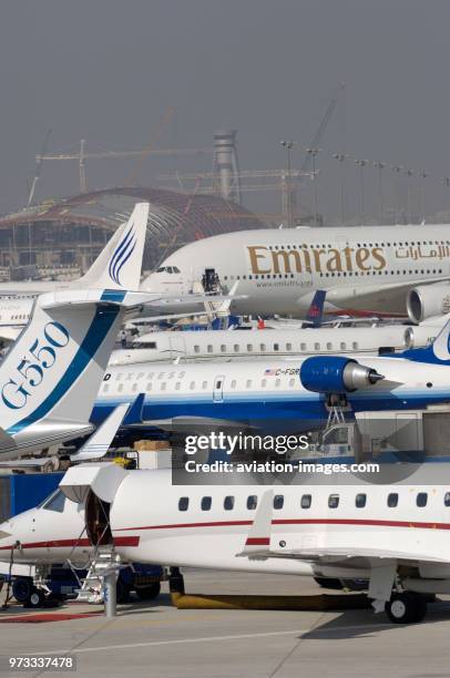 Embraer Legacy, Gulfstream 550, CRJ-700, Global Express, B737, A380 and others parked in the static-display.