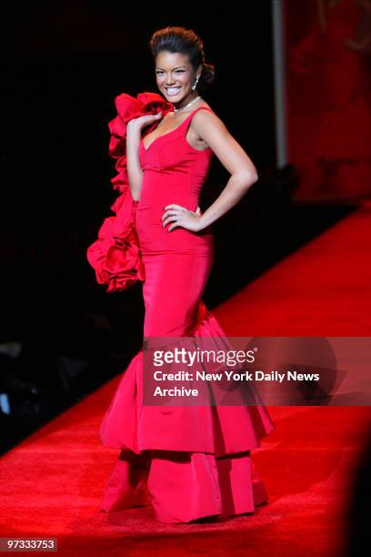 Miss Universe Zuleyka Rivera walks the runway at The Tent at Bryant Park as she participates in the Heart Truth Red Dress Collection show during New...