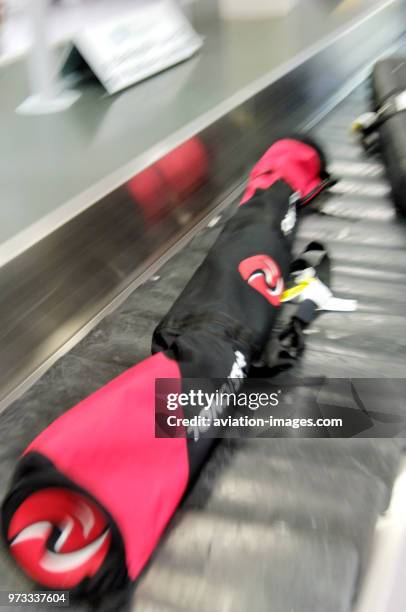 Skis on outsized baggage carousel.